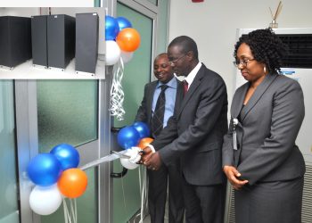Mr. Kameel Kajogbade Adebayo (ED, Operations & IT) cutting the tape to commission the ultra modern data recovery site. With him are Mr. Calleb Osei – Head, Financial Control and Mrs. Angela Okugo – Group Head, Channel Services