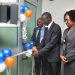 Mr. Kameel Kajogbade Adebayo (ED, Operations & IT) cutting the tape to commission the ultra modern data recovery site. With him are Mr. Calleb Osei – Head, Financial Control and Mrs. Angela Okugo – Group Head, Channel Services