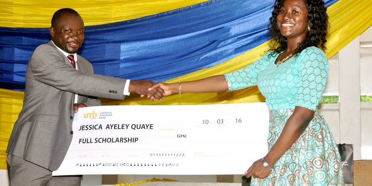 The CEO of UMB, Mr. John Awuah presenting the scholarship to Jessica Ayeley Quaye