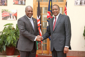 Kenyan President, Uhuru Kenya (r) in a handshake with President John Mahama