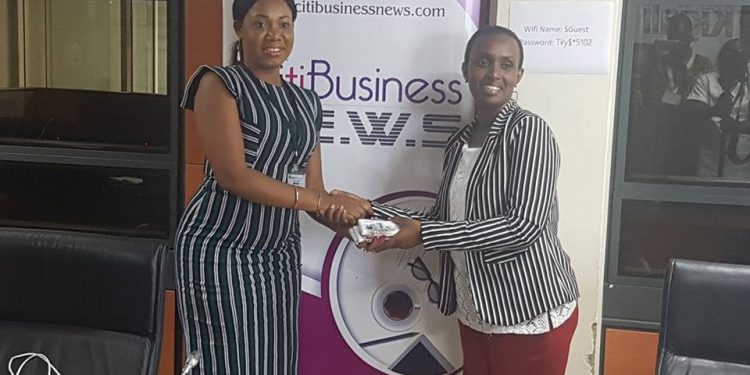 Vivian Kai Lokko presenting 'Ghana chocolate' to Winifred Ngangure, head of Investment Promotion