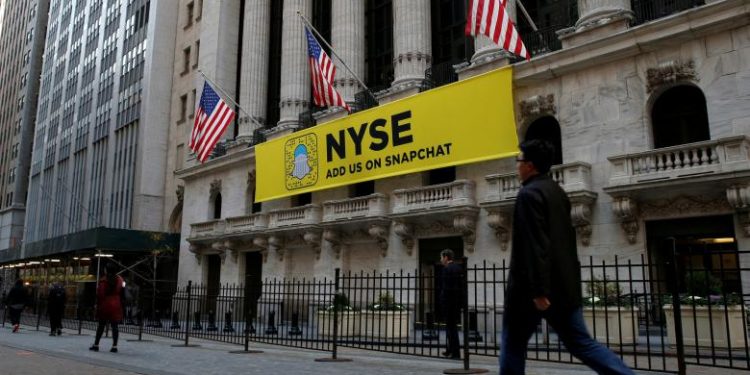 FILE PHOTO - The Snapchat logo is seen on a banner outside the New York Stock Exchange (NYSE) in New York City, U.S. on November 16, 2016.  REUTERS/Brendan McDermid/File Photo