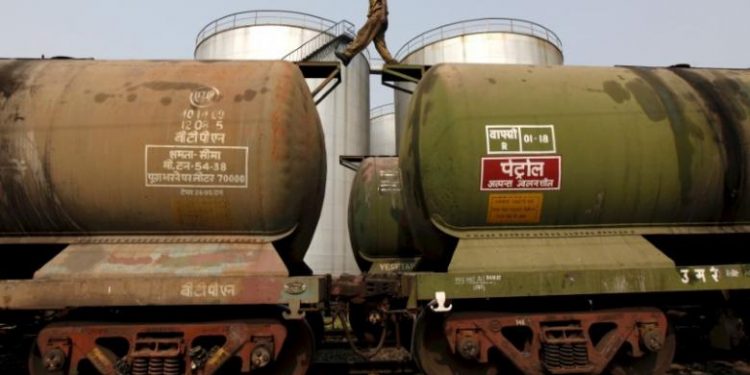 FILE PHOTO: A worker walks atop a tanker wagon to check the freight level at an oil terminal on the outskirts of Kolkata, India November 27, 2013. REUTERS/Rupak De Chowdhuri/File Photo - RTSXE0K