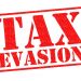 TAX EVASION red Rubber Stamp over a white background.